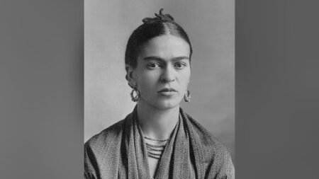 A black and white photograph of Mexican artist Frida Kahlo